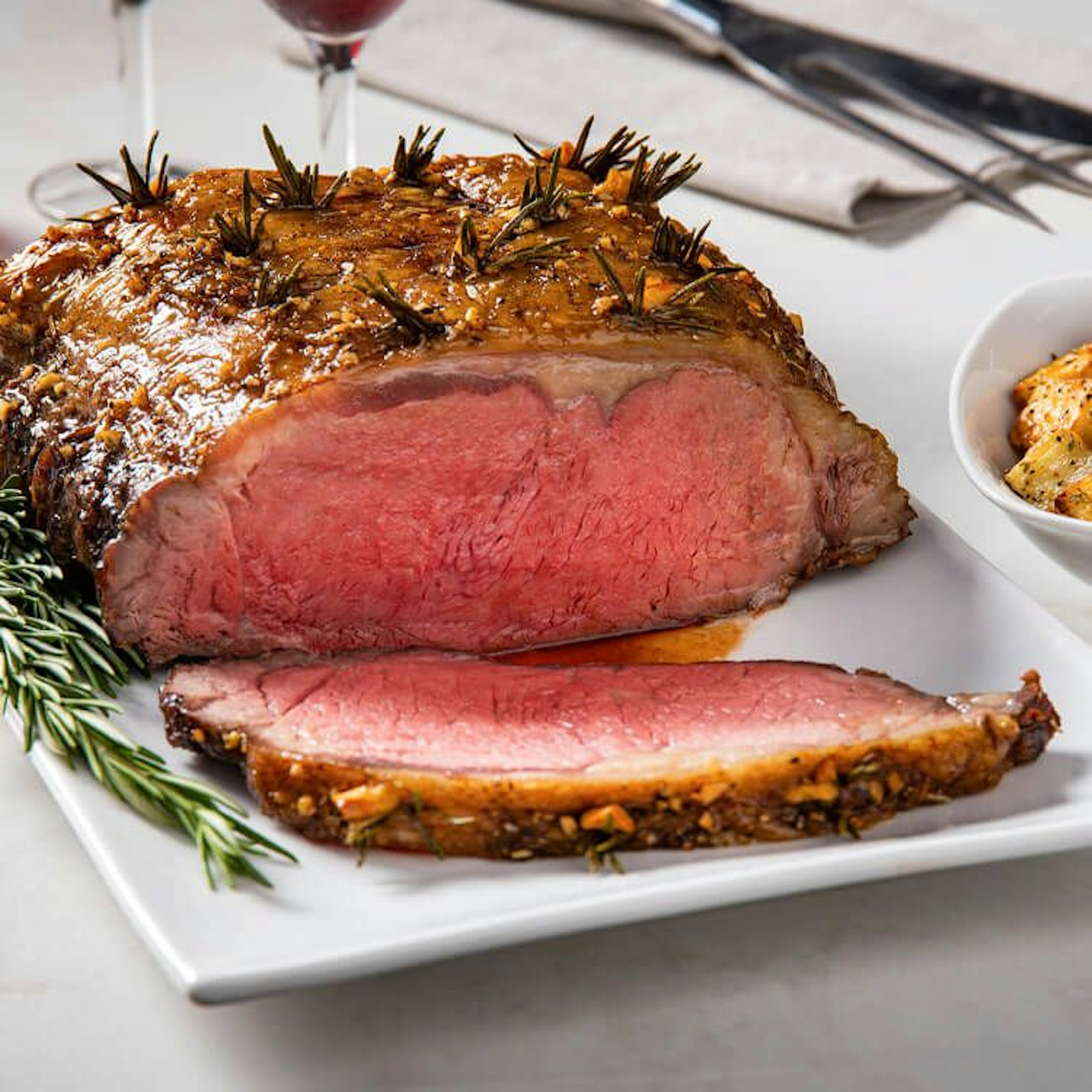 Garlic Rosemary Studded Strip Roast