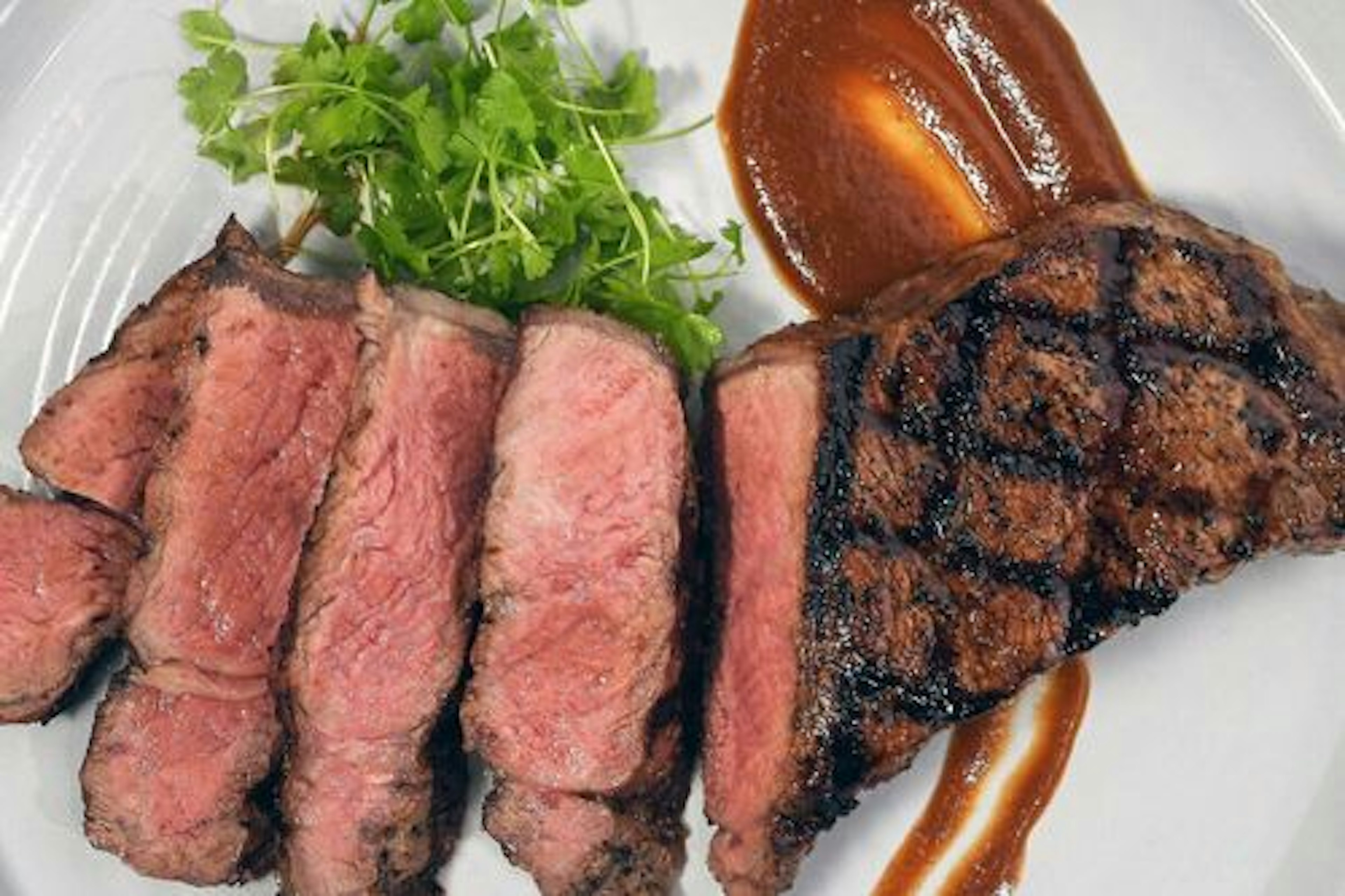 Evander’s Grilled Strip Steaks with Real Deal Steak Sauce