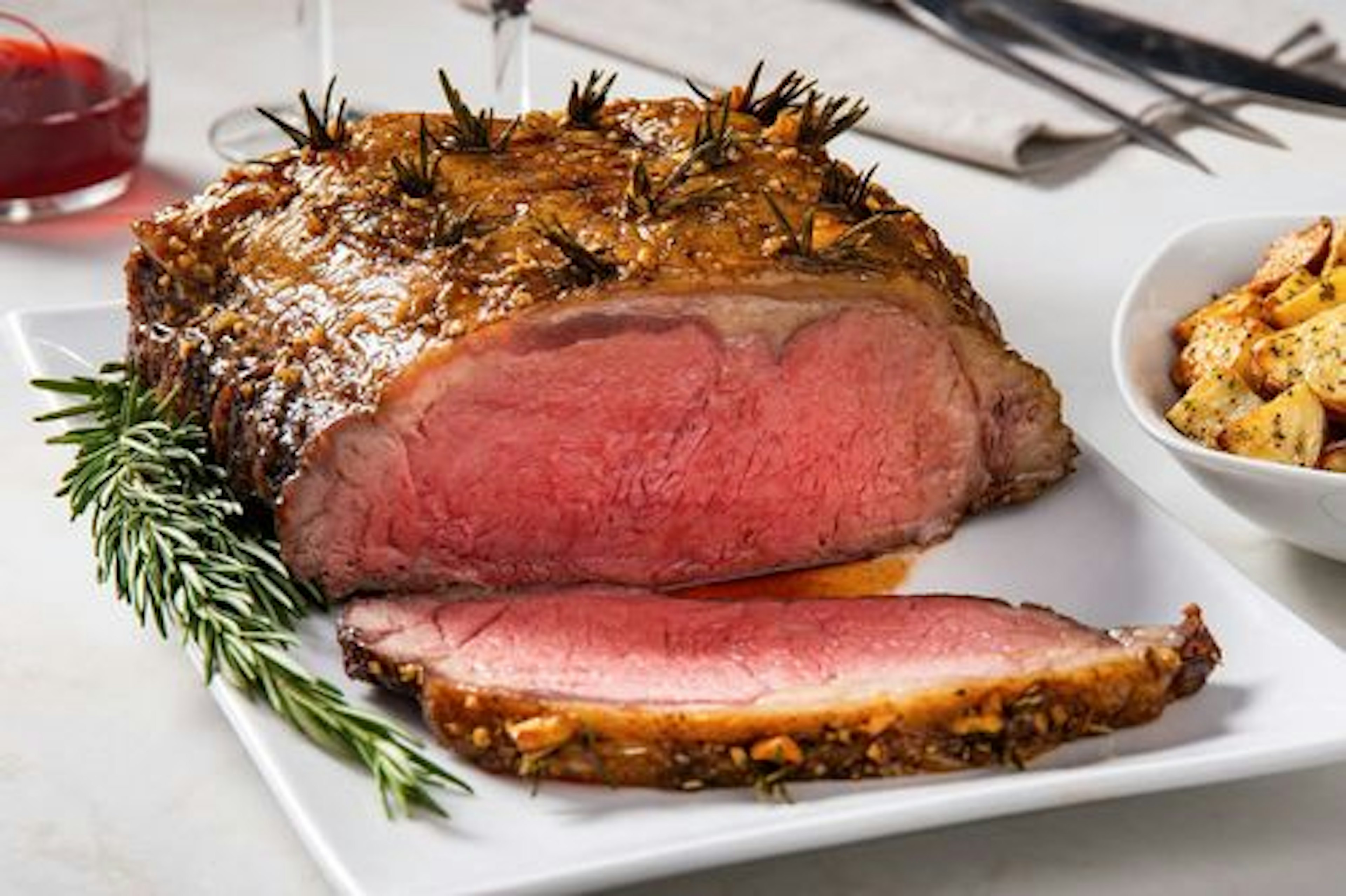 Garlic & Rosemary Studded Strip Roast