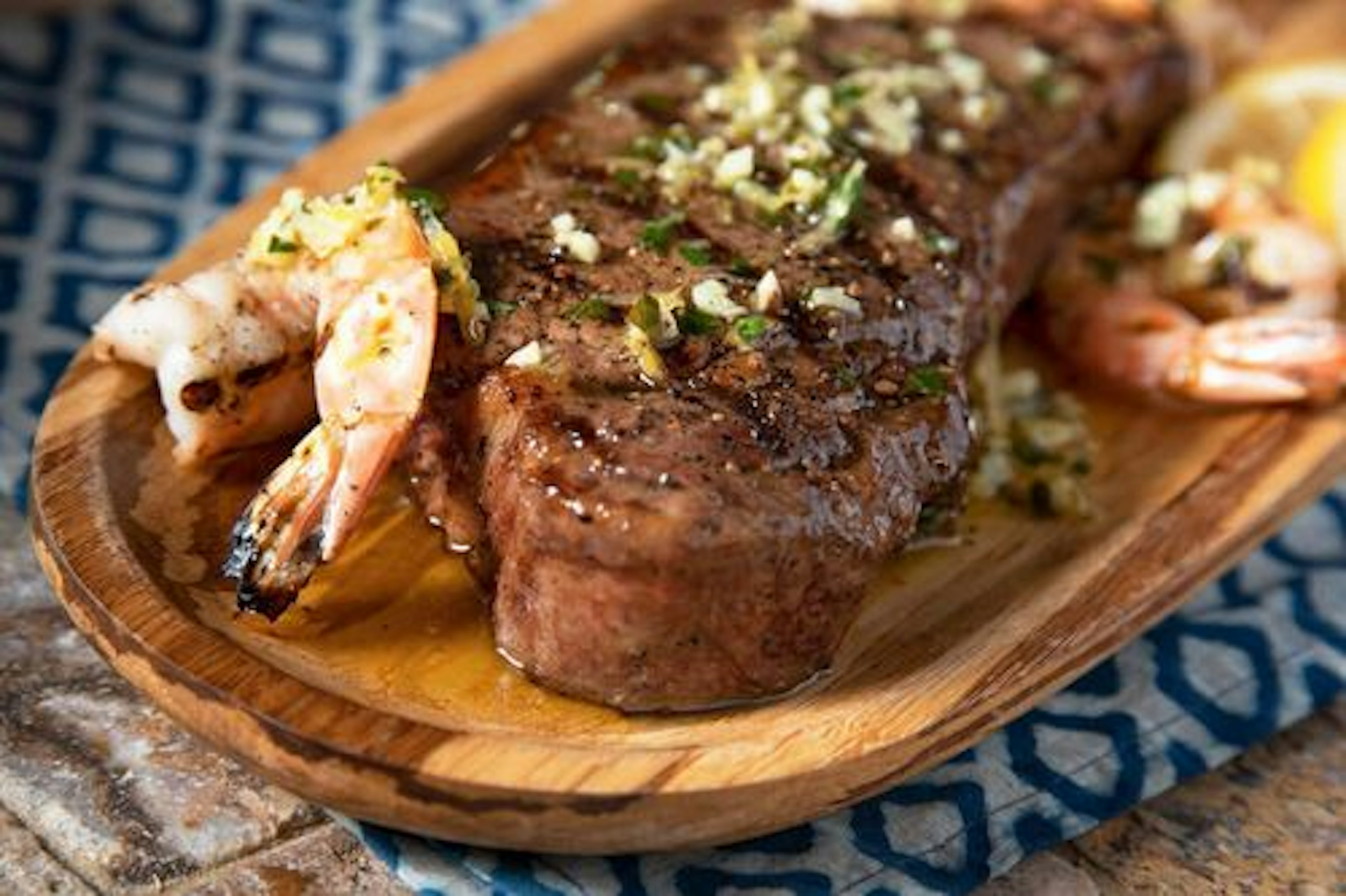 Strip Steaks with Shrimp and Scampi Butter