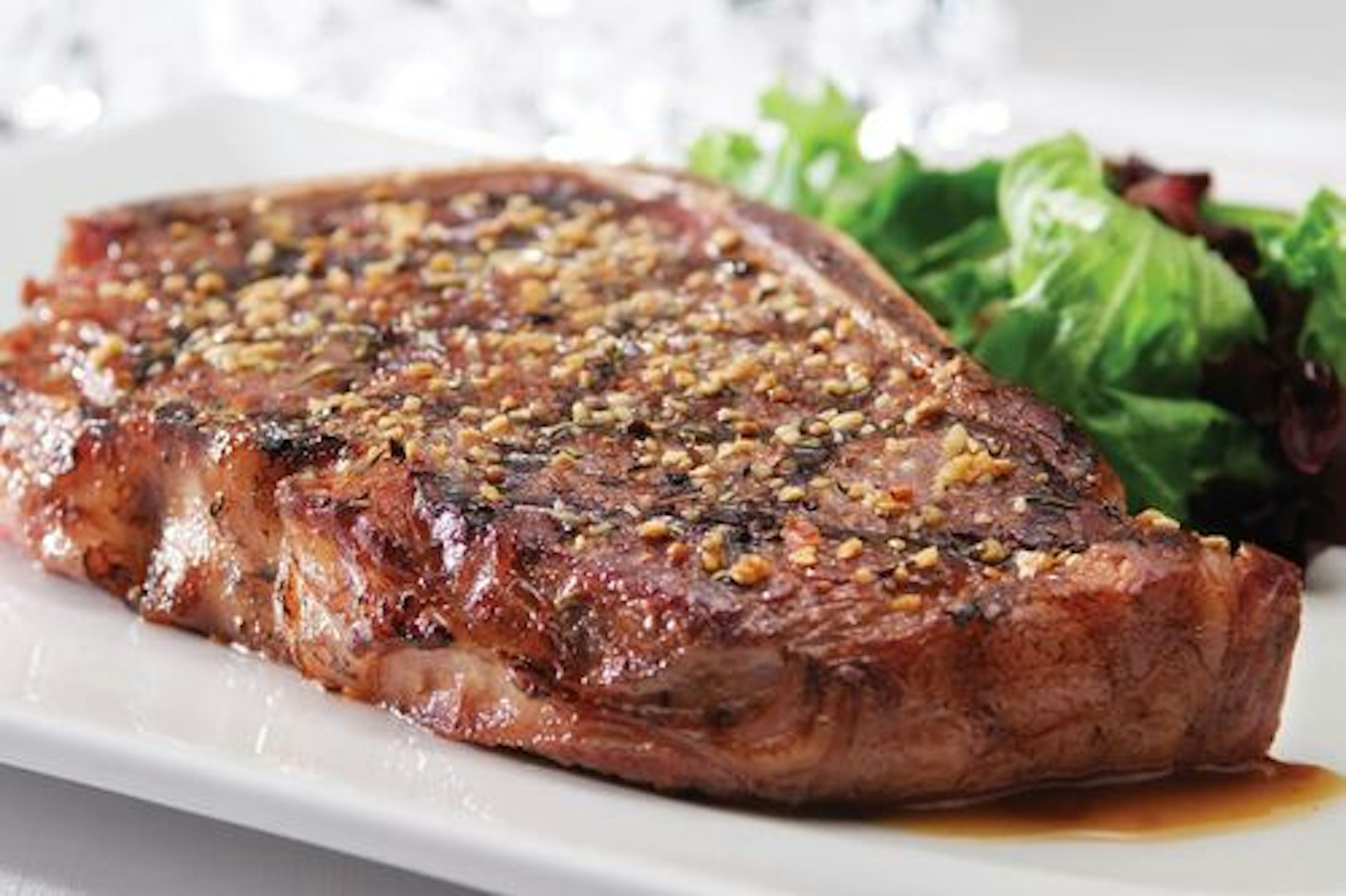 Strip Steaks with Three-Pepper Rub